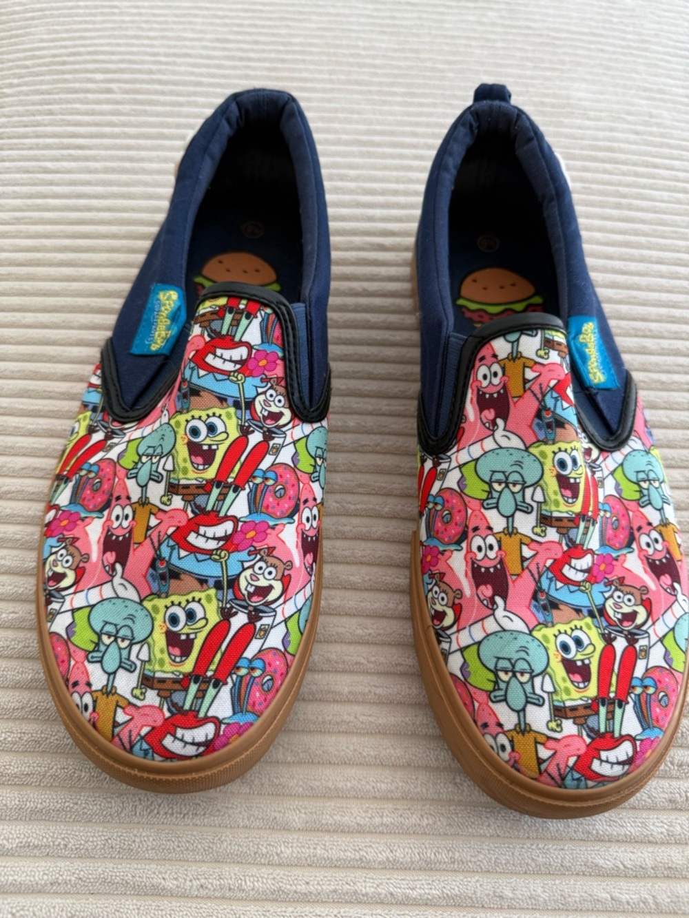 Men's Slip-On Graphic Sneakers with Multicolor Cartoon Print - Navy Trim